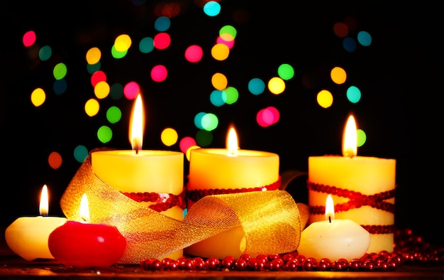 Beautiful candles on wooden table