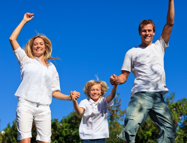 Beautiful caucasian Family Playing in the garden 