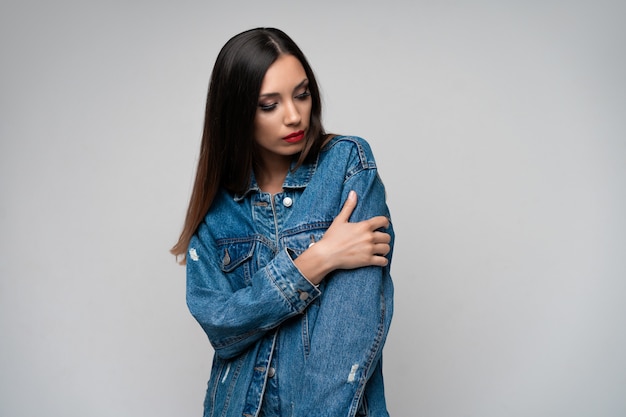 Beautiful caucasian girl denim jacket posing  