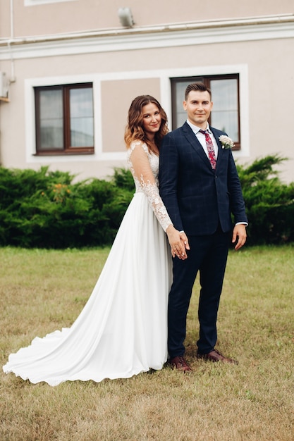 Beautiful caucasian woman poses for the camera with her handsome husband