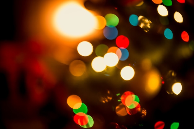 Beautiful Christmas background with blurred glowing colorful lights