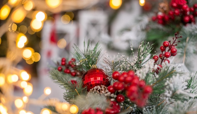 Beautiful Christmas background with red berries and lights