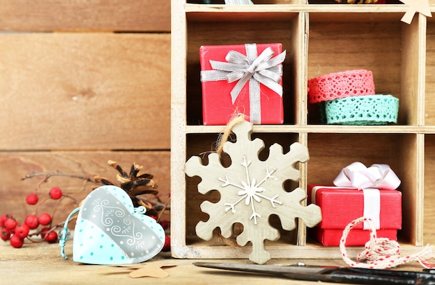 Beautiful Christmas composition with gifts in wooden crate