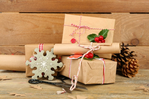 Beautiful Christmas composition with handmade gifts on wooden table