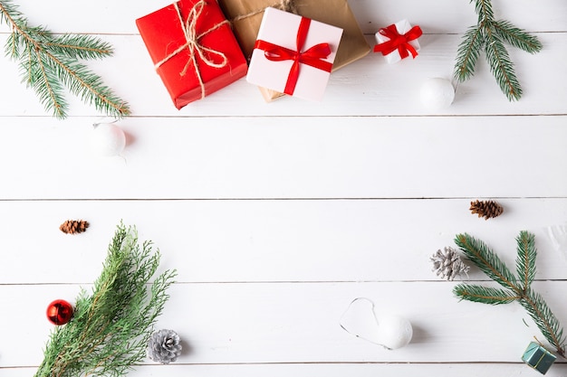 Beautiful Christmas composition on wooden white background with Christmas gift boxes. New Year.