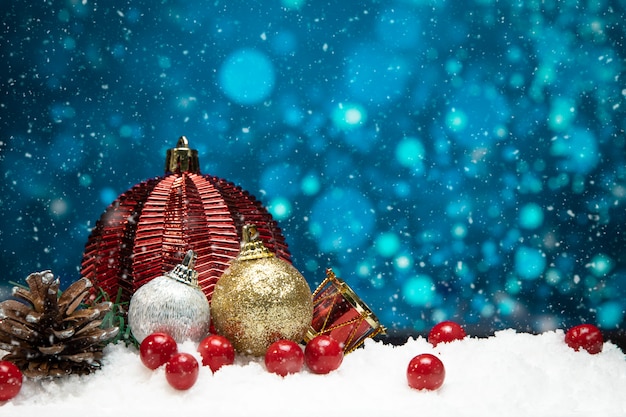 Beautiful christmas decoration on snow with blue bokeh background