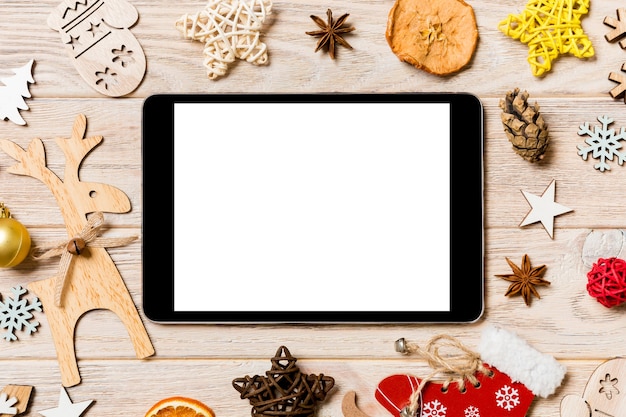 Beautiful Christmas decorations with a tablet on the table