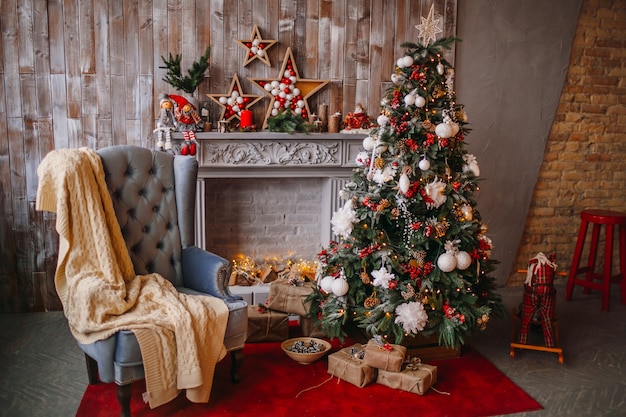 Beautiful Christmas tree rich decorated with toys 