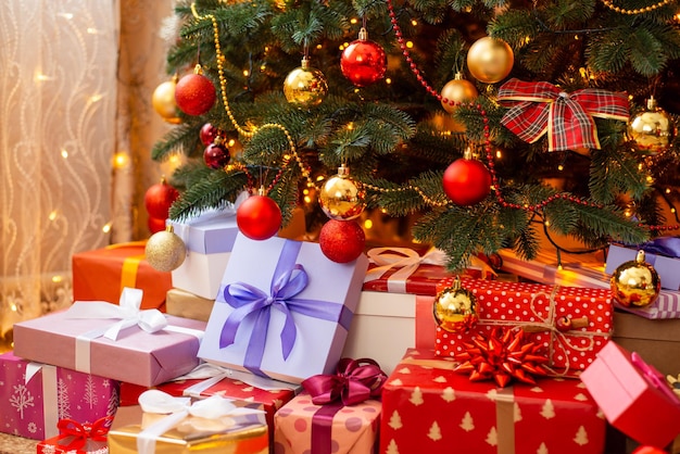 Beautiful christmas tree with many different presents beneath it Celebrating Christmas concept