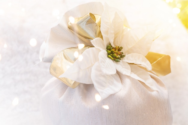 Beautiful Christmas white flower ribbon with bokeh