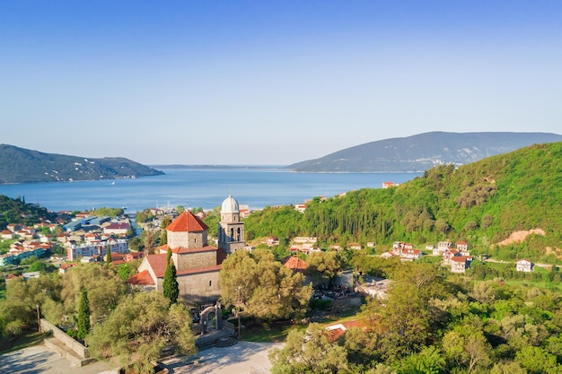 Beautiful city with a church near the sea top view