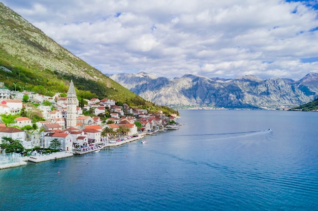 Beautiful city with red roofs in the mountains near the sea