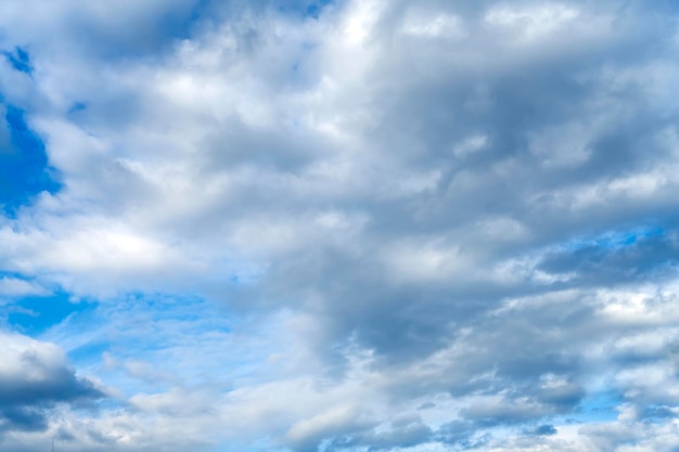 Beautiful clouds before sunset. Silvery blue sky with clouds