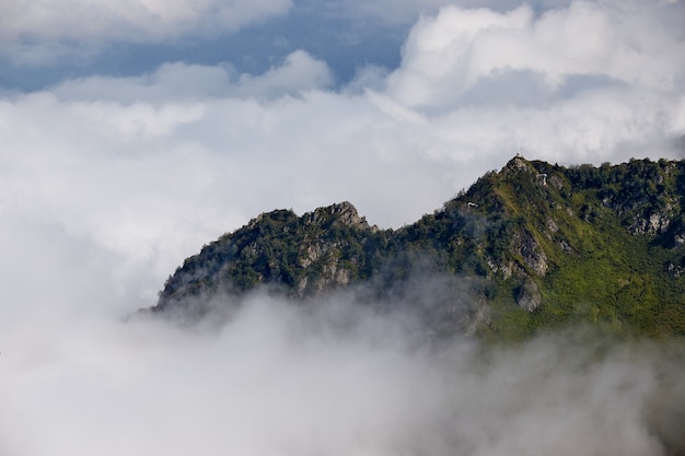 Beautiful clouds and fog among mountain landscape.