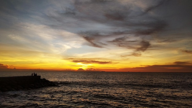 Beautiful clouds in the sky with a scenery of sunrise and the sea