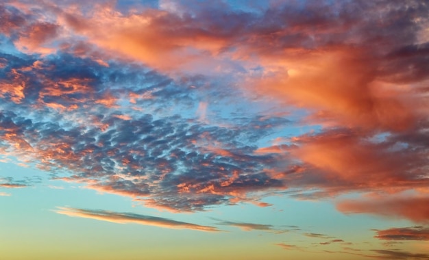 Beautiful cloudy evening sky with sun rays with purple tinge