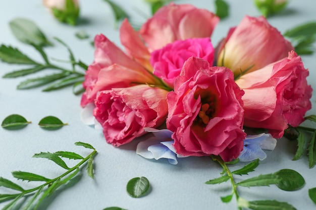 Beautiful composition with flowers on light background