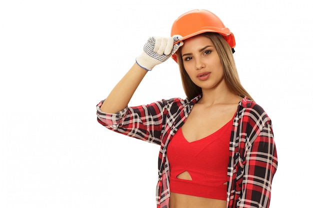 Beautiful confident woman with protective engineer hat