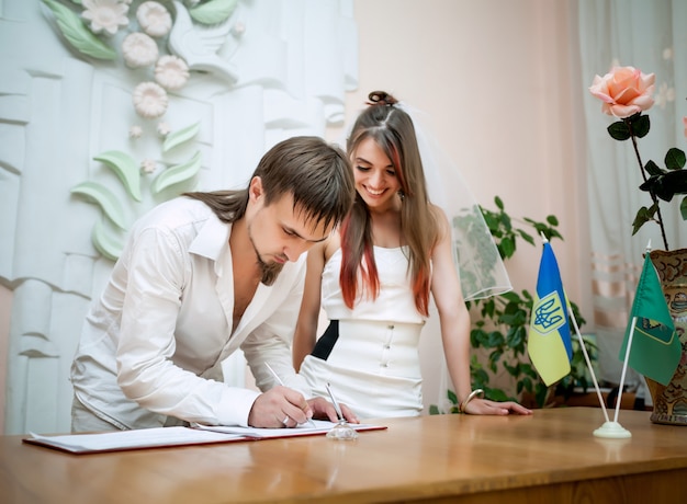 Beautiful couple having wedding ceremony 