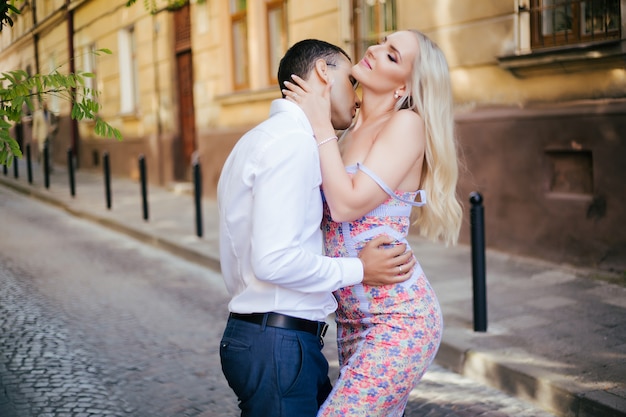 Beautiful couple in love dating outdoors and smiling