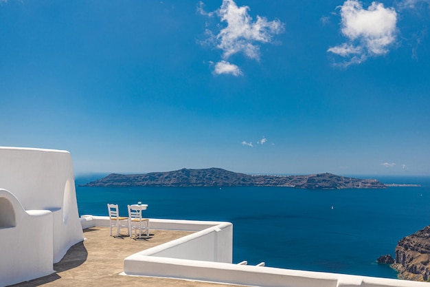 Beautiful couple travel scene two white chairs on caldera, romance vacation Santorini island, Greece