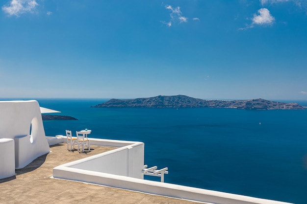 Beautiful couple travel scene two white chairs on caldera, romance vacation Santorini island, Greece