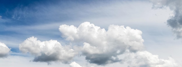 Beautiful curly white clouds in the blue sky