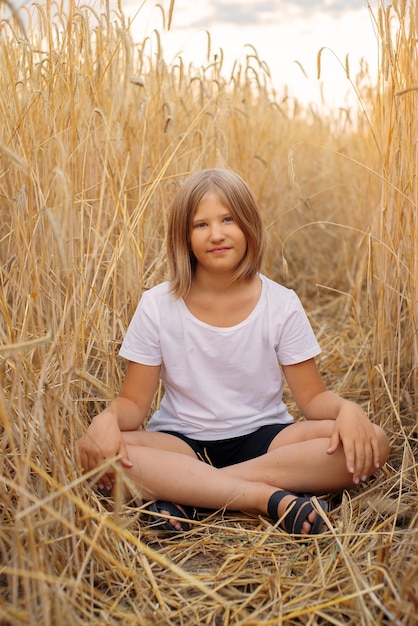 beautiful cute girl in wheat field, happy childhood