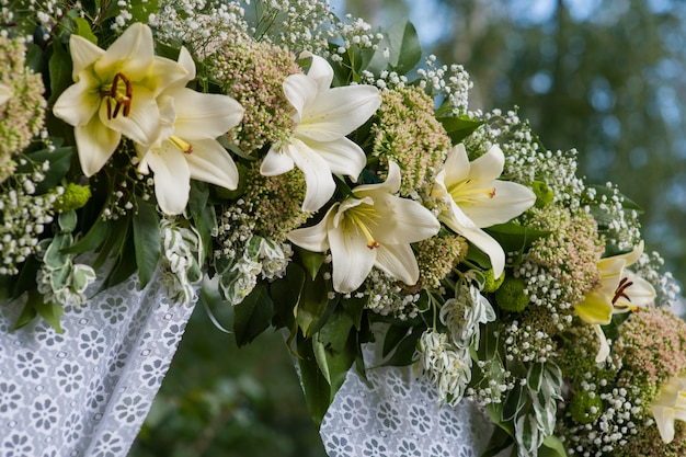 Beautiful decorated wedding arch for the ceremony outdoor