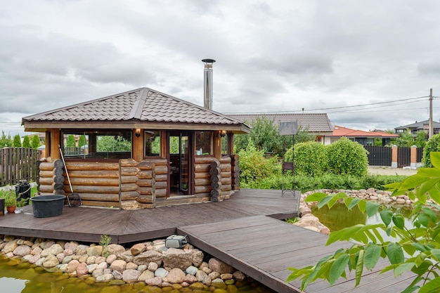 Beautiful decorative house in the garden, gazebo in summer. Summer kitchen or a place for games and barbecue.