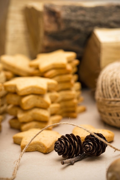 Beautiful delicious christmas gingerbread at the wooden background and bumps in the foreground