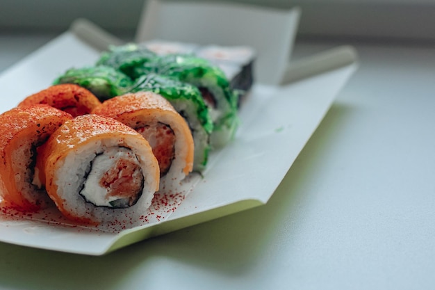 Beautiful delicious sushi Sushi delivery Advertising sushi rolls made of fish and cheese