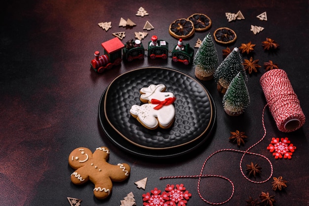 Beautiful different Christmas decorations and gingerbread on a brown concrete table