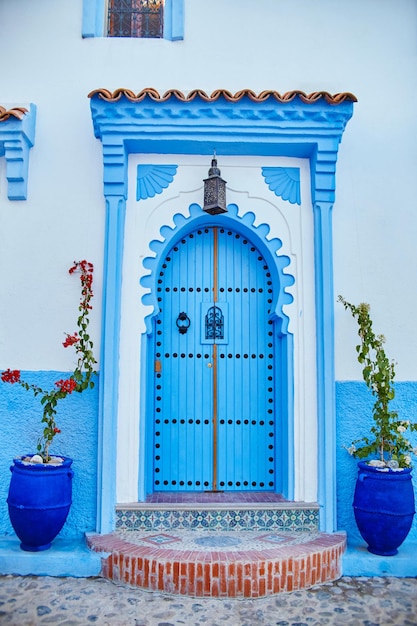 Beautiful diverse set of blue doors of the blue city of Chefchaouen in Morocco. Streets of the city are painted in blue in various shades. Fabulous blue town