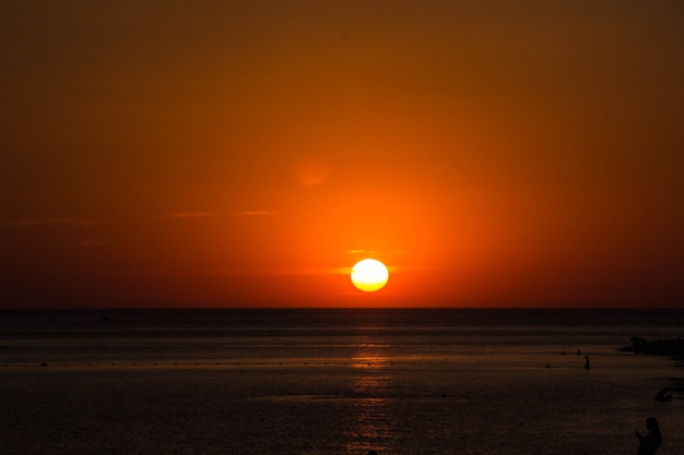 Beautiful dramatic dark sunset above the sea