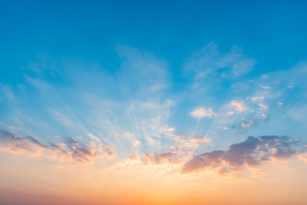 Beautiful dramatic sunset sky with orange and blue colored clouds. 