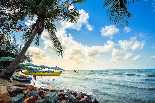 Beautiful early morning sunrise over Banana boat lays under Coconut tree