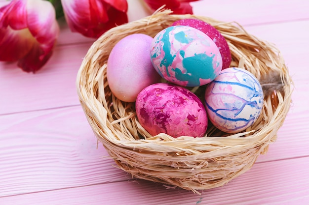 Beautiful Easter composition with decorated eggs and flowers