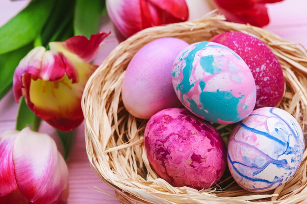 Beautiful Easter composition with decorated eggs and flowers