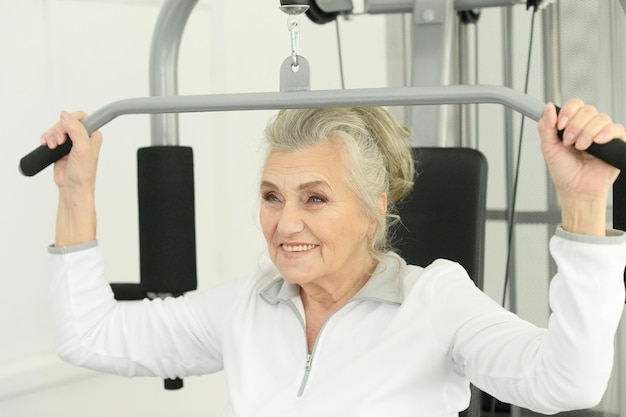 Beautiful elderly woman in a gym