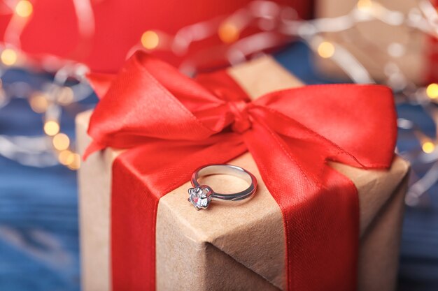 Beautiful engagement ring on gift box, closeup