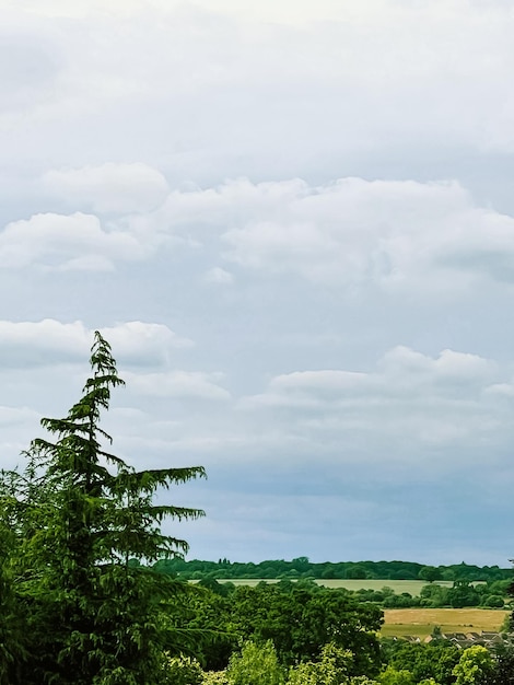 Beautiful English countryside landscape in Hertfordshire England United Kingdom green foliage villages and cloudy sky weather and nature