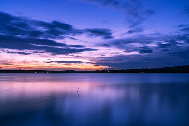 beautiful Evening sky clouds with sunset on the lake.