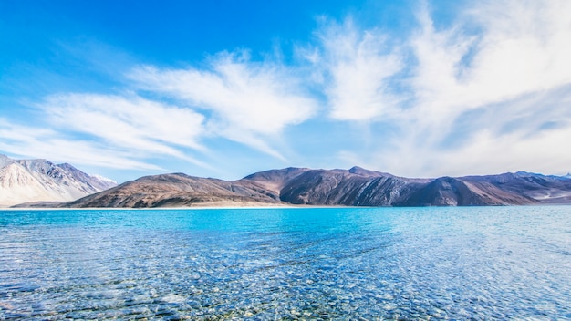 Beautiful exotic summer landscape of blue sky mountain and lake with reflection of cloud.