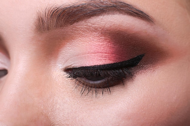 Beautiful eye makeup closeup. Female model face with fashion make-up, beauty concept isolated