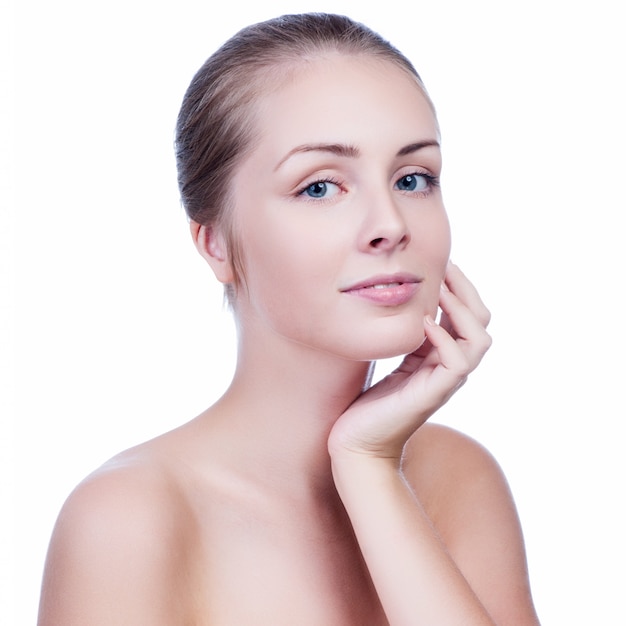 Beautiful face of young adult woman with clean fresh skin  on white