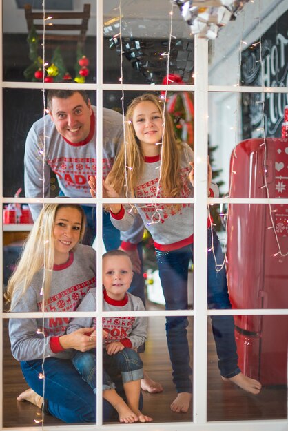 Beautiful family in sweaters on Christmas