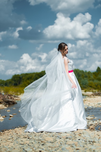 beautiful fashion bride on the wedding day outdoor on the river