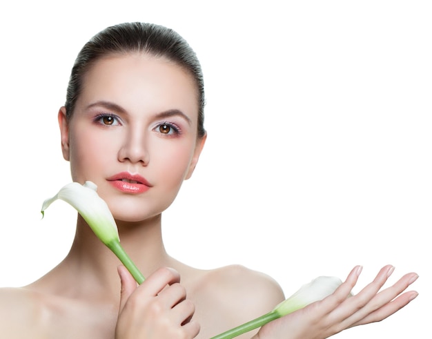 Beautiful female face isolated Young woman with healthy skin and white flower on white background Facial treatment beauty skincare and spa concept