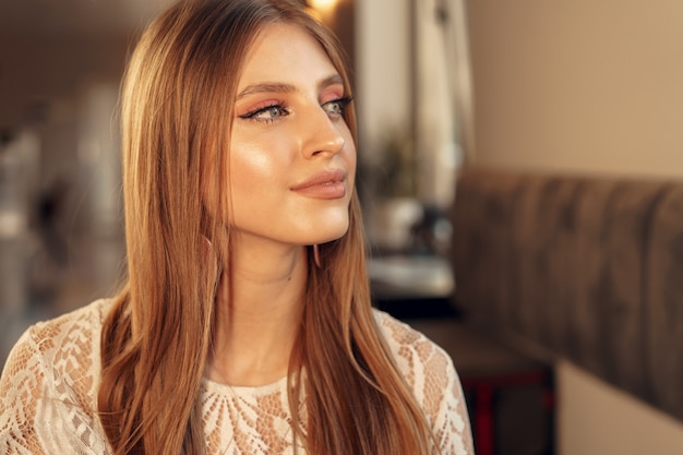 Beautiful female model portrait in a cafe